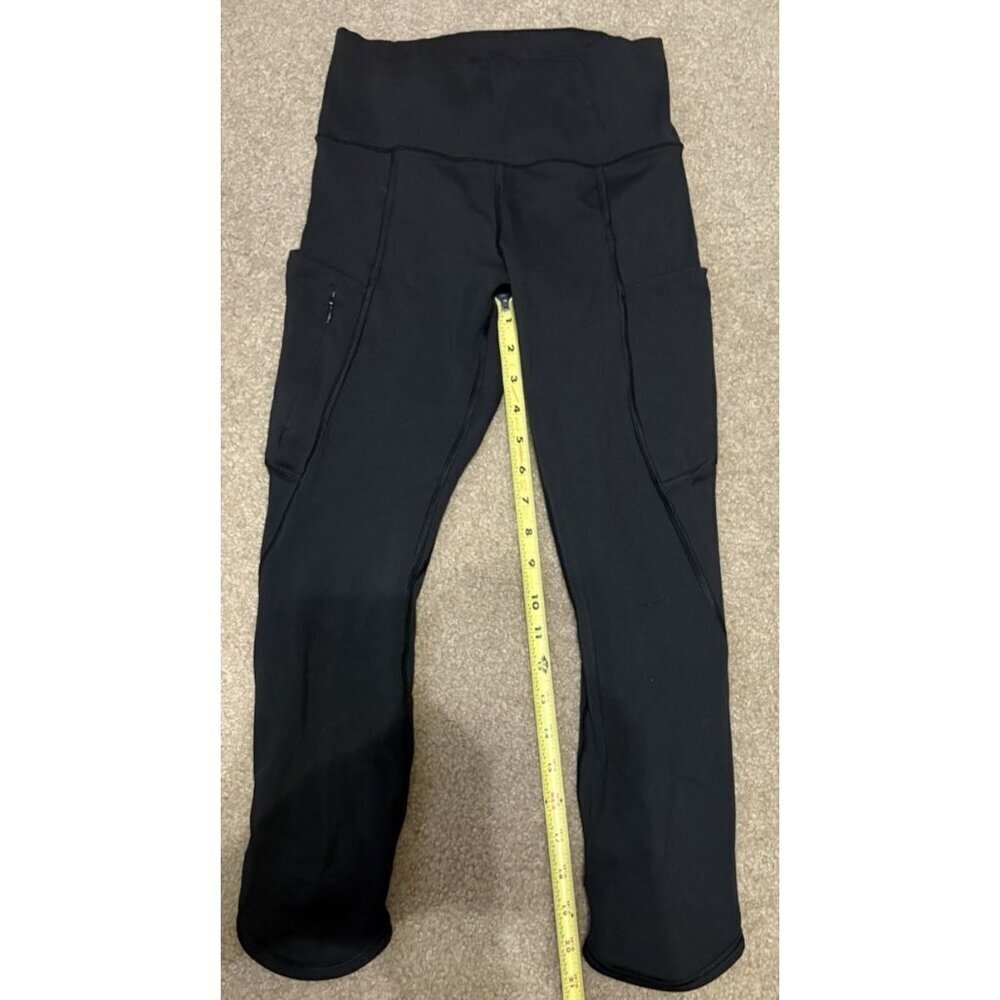 Women’s black Athleta leggings with zippered side pocket size XS Inseam 21"